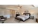 Bright main bedroom with tray ceilings, decorative molding, and neutral tones and decor at 200 Claret Way, Mcdonough, GA 30252
