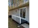 Back porch of home with a porch, sliding glass door, and trees at 2755 Berry Rd, Loganville, GA 30052