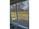 A sliding glass door opens onto a deck with a view of a green, wooded backyard at 2755 Berry Rd, Loganville, GA 30052