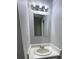 Traditional bathroom featuring a standard sink with a large mirror and classic vanity lighting at 2755 Berry Rd, Loganville, GA 30052