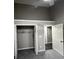 Neutral bedroom with gray walls, white trim, and carpeted floors, featuring closet and doorway at 2755 Berry Rd, Loganville, GA 30052