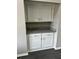 Recessed nook with upper and lower cabinets and granite countertops at 2755 Berry Rd, Loganville, GA 30052