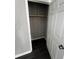 A closet features a wooden shelf and dark flooring at 2755 Berry Rd, Loganville, GA 30052