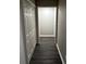 A hallway with a closet features dark wood floors at 2755 Berry Rd, Loganville, GA 30052