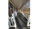 View across long porch with white railings at 2755 Berry Rd, Loganville, GA 30052