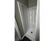 Bathroom shower with a shower stall and built-in shelving at 2755 Berry Rd, Loganville, GA 30052
