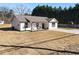 House with a spacious yard and a concrete driveway at 2605 Bobo Rd, Dallas, GA 30157