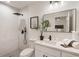 Modern bathroom with marble shower and white vanity at 2605 Bobo Rd, Dallas, GA 30157
