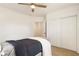Simple bedroom with double door closet and ceiling fan at 2605 Bobo Rd, Dallas, GA 30157