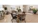 Bright dining area with glass table and four chairs, hardwood floors, and access to living room at 2605 Bobo Rd, Dallas, GA 30157