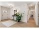 Bright and airy entryway with a modern console table and large plant at 2605 Bobo Rd, Dallas, GA 30157