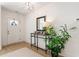 Bright entryway with a white door, console table, and large plant at 2605 Bobo Rd, Dallas, GA 30157