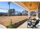Inviting front porch with two black chairs and a small table at 2605 Bobo Rd, Dallas, GA 30157