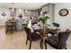 Modern kitchen with gray cabinets, quartz countertops, and a glass-top dining table at 2605 Bobo Rd, Dallas, GA 30157