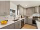 Gray shaker cabinets, white subway tile backsplash, and stainless steel appliances at 2605 Bobo Rd, Dallas, GA 30157