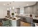 Modern kitchen with gray cabinets, white quartz countertops, and stainless steel appliances at 2605 Bobo Rd, Dallas, GA 30157