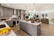 Open concept kitchen with gray cabinets and large island at 2605 Bobo Rd, Dallas, GA 30157