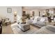 Bright living room with comfy sofas, large windows, and a neutral color palette at 2605 Bobo Rd, Dallas, GA 30157