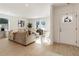 Spacious living room with beige couch and hardwood floors at 2605 Bobo Rd, Dallas, GA 30157