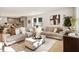 Spacious living room featuring neutral-toned sofas and large windows at 2605 Bobo Rd, Dallas, GA 30157