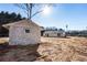 Rustic stone shed with a view of the house at 2605 Bobo Rd, Dallas, GA 30157