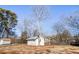 Whitewashed stone storage shed in the backyard at 2605 Bobo Rd, Dallas, GA 30157