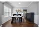 Bright dining room features wood floors, white trim, natural light and neutral walls at 456 Crestmont Ln, Canton, GA 30114