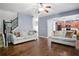 Open living room with hardwood floors, ceiling fan, and access to the kitchen at 456 Crestmont Ln, Canton, GA 30114