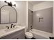 Modern bathroom with gray tile and a bathtub at 1005 Middlebrooke Dr, Canton, GA 30115