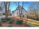 Two-story white home with black accents and landscaped yard at 1005 Middlebrooke Dr, Canton, GA 30115