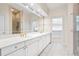 Elegant bathroom with double vanity, large mirror, and shower at 3657 Peachtree Ne Rd # 3C, Atlanta, GA 30319