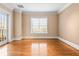 Spacious bedroom with hardwood floors and large window at 3657 Peachtree Ne Rd # 3C, Atlanta, GA 30319