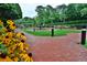 Courtyard with fountain, brick walkways, and lush landscaping at 3657 Peachtree Ne Rd # 3C, Atlanta, GA 30319