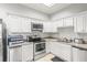 Modern kitchen with stainless steel appliances and granite counters at 3657 Peachtree Ne Rd # 3C, Atlanta, GA 30319