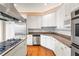 Eat-in kitchen with stainless steel appliances and granite counters at 3657 Peachtree Ne Rd # 3C, Atlanta, GA 30319