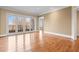 Bright living room with hardwood floors and French doors leading to a balcony at 3657 Peachtree Ne Rd # 3C, Atlanta, GA 30319