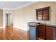 Wet bar with wood cabinetry and shelving in living area at 3657 Peachtree Ne Rd # 3C, Atlanta, GA 30319