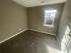 Well lit bedroom with carpet and window at 5787 Summerglenn Ln, Atlanta, GA 30349