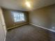 Simple bedroom with neutral decor and carpeted floors at 5787 Summerglenn Ln, Atlanta, GA 30349