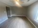 Spacious living room featuring hardwood floors and neutral walls at 5787 Summerglenn Ln, Atlanta, GA 30349