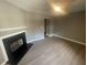 Cozy living room featuring a fireplace and hardwood floors at 5787 Summerglenn Ln, Atlanta, GA 30349