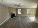 Bright living room with fireplace and hardwood floors at 5787 Summerglenn Ln, Atlanta, GA 30349