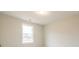 Simple bedroom with a window and neutral walls at 1700 Fulmont Cir, Mableton, GA 30126