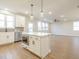 Modern kitchen with white cabinets, quartz countertops, and stainless steel appliances at 1700 Fulmont Cir, Mableton, GA 30126