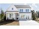 Two-story home with white siding, dark roof, and a covered entryway, plus a concrete driveway at 128 Kingsley Way, Acworth, GA 30102