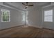 A lovely bedroom with big windows and hardwood floors at 3007 Holly St, Canton, GA 30115