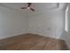 A empty bedroom with gorgeous hardwood floors, white trim, and three closets at 3007 Holly St, Canton, GA 30115