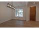 Bright dining room features stylish lighting, wood floors, and a large window at 3007 Holly St, Canton, GA 30115