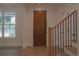 Entryway features hardwood floors, stairs, and a decorative wooden door at 3007 Holly St, Canton, GA 30115