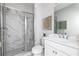 Modern bathroom with a marble-tiled shower, glass door, and contemporary vanity at 353 Skylar Se Way, Atlanta, GA 30315